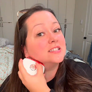 woman using AuraLift Gua Sha on puffy neck