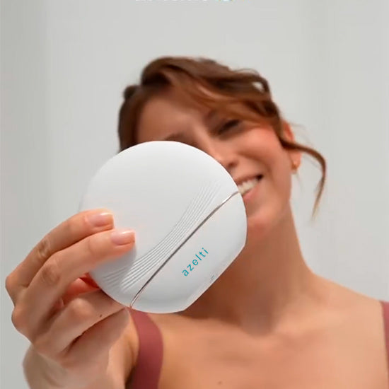 woman presenting gua sha massager
